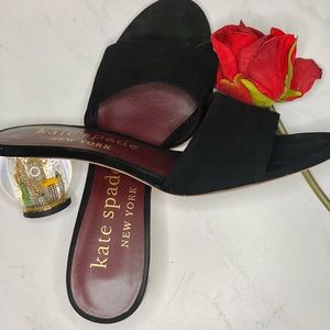 Festive black shade lose heel sandal. Heel is a limited edition NYC snow globe!